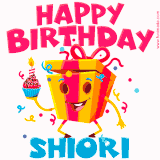 A vibrant and funny gift box character with a happy face dancing with a cupcake and the text 'Happy Birthday Shiori,' surrounded by animated confetti and party vibes.