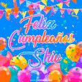 A vibrant animated GIF with 'Feliz Cumpleaños Shiv' written in colorful script, surrounded by balloons, confetti, and bunting on a bright blue background.