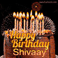 A rich chocolate cake topped with glowing birthday candles and surrounded by bright fireworks. The animated GIF displays the message 'Happy Birthday Shivaay' in golden text.