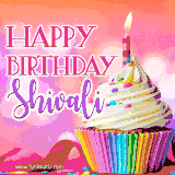 A vibrant birthday GIF featuring a rainbow-colored cupcake topped with white frosting, sprinkles, and a lit candle. The text reads 'Happy Birthday Shivali' in bold pink and violet letters with white outline.