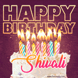 A colorful birthday cake topped with lit candles, with the words 'Happy Birthday Shivali' in bold glowing letters on a burgundy background. Animated flames add a festive touch.