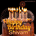 A rich chocolate cake topped with glowing birthday candles and surrounded by bright fireworks. The animated GIF displays the message 'Happy Birthday Shivam' in golden text.
