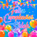 A vibrant animated GIF with 'Feliz Cumpleaños Shlok' written in colorful script, surrounded by balloons, confetti, and bunting on a bright blue background.
