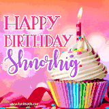A vibrant birthday GIF featuring a rainbow-colored cupcake topped with white frosting, sprinkles, and a lit candle. The text reads 'Happy Birthday Shnorhig' in bold pink and violet letters with white outline.