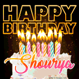 A vibrant animated GIF featuring a delicious birthday cake topped with glowing candles and the name 'Shourya' in elegant script, and the words 'Happy Birthday' on the black background.