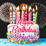 A lively happy birthday animated GIF showcasing a colorful birthday cake covered in sprinkles, topped with glowing candles, and surrounded by vibrant fireworks. The name 'Shourya' is featured in elegant script.