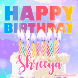 A vibrant animated name GIF with the words 'Happy Birthday Shreeya' with colorful candles on a creamy cake. The background sparkles with pastel shades, adding a festive touch.