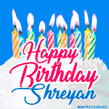 A cheerful animated GIF featuring colorful lit birthday candles on a white cake, with the text 'Happy Birthday Shreyan' in bold red and blue script on a bright blue background.