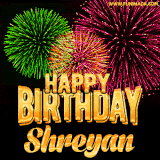 A captivating GIF with bursts of green, pink, and orange fireworks lighting up the night sky, accompanied by 'Happy Birthday Shreyan' in glowing golden text.