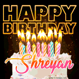 A vibrant animated GIF featuring a delicious birthday cake topped with glowing candles and the name 'Shreyan' in elegant script, and the words 'Happy Birthday' on the black background.