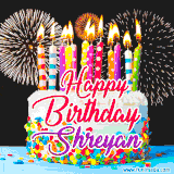 A lively happy birthday animated GIF showcasing a colorful birthday cake covered in sprinkles, topped with glowing candles, and surrounded by vibrant fireworks. The name 'Shreyan' is featured in elegant script.