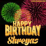 A captivating GIF with bursts of green, pink, and orange fireworks lighting up the night sky, accompanied by 'Happy Birthday Shreyas' in glowing golden text.
