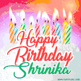 Bright birthday candles with rainbow flames on a cake, alongside the text 'Happy Birthday Shrinika' in vibrant script in this celebratory animated GIF.