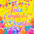 A bright and festive GIF with the text 'Feliz Cumpleaños Shrinika' in Spanish in colorful fonts, surrounded by confetti, balloons, and festive banners on a vibrant yellow background.