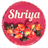 Beautifully decorated red velvet berry birthday cake with vibrant fruits and a glowing 'Shriya' name, adding a touch of sweetness and sparkle.
