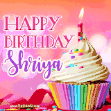 A vibrant birthday GIF featuring a rainbow-colored cupcake topped with white frosting, sprinkles, and a lit candle. The text reads 'Happy Birthday Shriya' in bold pink and violet letters with white outline.