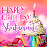 A vibrant birthday GIF featuring a rainbow-colored cupcake topped with white frosting, sprinkles, and a lit candle. The text reads 'Happy Birthday Shulammite' in bold pink and violet letters with white outline.