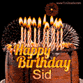 A rich chocolate cake topped with glowing birthday candles and surrounded by bright fireworks. The animated GIF displays the message 'Happy Birthday Sid' in golden text.