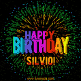 A colorful animated GIF featuring the text 'Happy Birthday Silvio!' in rainbow colors with a dynamic iridescent firework display in the background.