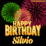 A captivating GIF with bursts of green, pink, and orange fireworks lighting up the night sky, accompanied by 'Happy Birthday Silvio' in glowing golden text.
