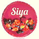 Beautifully decorated red velvet berry birthday cake with vibrant fruits and a glowing 'Siya' name, adding a touch of sweetness and sparkle.