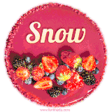Beautifully decorated red velvet berry birthday cake with vibrant fruits and a glowing 'Snow' name, adding a touch of sweetness and sparkle.