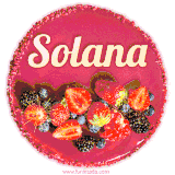 Beautifully decorated red velvet berry birthday cake with vibrant fruits and a glowing 'Solana' name, adding a touch of sweetness and sparkle.