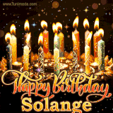 A glowing personalized birthday GIF with name Solange featuring lit candles with intricate designs, warm lighting, and the text 'Happy Birthday' in an elegant font.