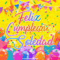A bright and festive GIF with the text 'Feliz Cumpleaños Soledad' in Spanish in colorful fonts, surrounded by confetti, balloons, and festive banners on a vibrant yellow background.