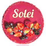 Beautifully decorated red velvet berry birthday cake with vibrant fruits and a glowing 'Solei' name, adding a touch of sweetness and sparkle.
