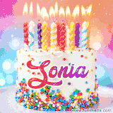 A cheerful white birthday cake with multicolor sprinkles, lit candles, and 'Sonia' written in vibrant letters, in an animated GIF.