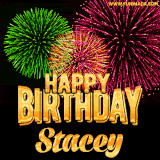 A captivating GIF with bursts of green, pink, and orange fireworks lighting up the night sky, accompanied by 'Happy Birthday Stacey' in glowing golden text.