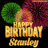 A captivating GIF with bursts of green, pink, and orange fireworks lighting up the night sky, accompanied by 'Happy Birthday Stanley' in glowing golden text.