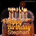 A rich chocolate cake topped with glowing birthday candles and surrounded by bright fireworks. The animated GIF displays the message 'Happy Birthday Stephan' in golden text.