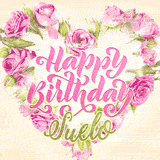 A stunning heart made of pink roses surrounds the elegant script text 'Happy Birthday Suelo' on a soft beige background. Animated sparkles add a magical and festive feel.
