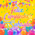 A bright and festive GIF with the text 'Feliz Cumpleaños Suhayla' in Spanish in colorful fonts, surrounded by confetti, balloons, and festive banners on a vibrant yellow background.