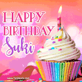A vibrant birthday GIF featuring a rainbow-colored cupcake topped with white frosting, sprinkles, and a lit candle. The text reads 'Happy Birthday Suki' in bold pink and violet letters with white outline.
