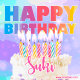 A vibrant animated name GIF with the words 'Happy Birthday Suki' with colorful candles on a creamy cake. The background sparkles with pastel shades, adding a festive touch.