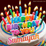 A colorful birthday cake topped with lit candles, with the words 'Happy Birthday Sumayah' in bold glowing letters on a burgundy background. Animated flames add a festive touch.