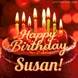 Beautifully decorated red velvet berry birthday cake with vibrant fruits and a glowing 'Susan' name, adding a touch of sweetness and sparkle.