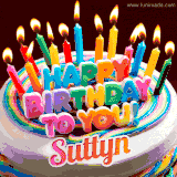 A colorful birthday cake topped with lit candles, with the words 'Happy Birthday Suttyn' in bold glowing letters on a burgundy background. Animated flames add a festive touch.