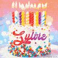 Personalized for Sylvie elegant birthday cake adorned with rainbow sprinkles, colorful candles and glitter