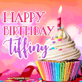 A vibrant birthday GIF featuring a rainbow-colored cupcake topped with white frosting, sprinkles, and a lit candle. The text reads 'Happy Birthday Tiffiny' in bold pink and violet letters with white outline.
