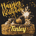 Celebrate Tinley's birthday with a GIF featuring chocolate cake, a lit sparkler, and golden stars