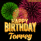 A captivating GIF with bursts of green, pink, and orange fireworks lighting up the night sky, accompanied by 'Happy Birthday Torrey' in glowing golden text.