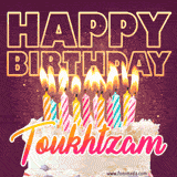A colorful birthday cake topped with lit candles, with the words 'Happy Birthday Toukhtzam' in bold glowing letters on a burgundy background. Animated flames add a festive touch.