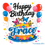 Close-up of a floral birthday cake with a bold blue name tag spelling Trace under colorful balloon decorations.