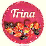 Beautifully decorated red velvet berry birthday cake with vibrant fruits and a glowing 'Trina' name, adding a touch of sweetness and sparkle.
