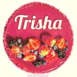 Beautifully decorated red velvet berry birthday cake with vibrant fruits and a glowing 'Trisha' name, adding a touch of sweetness and sparkle.