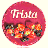 Beautifully decorated red velvet berry birthday cake with vibrant fruits and a glowing 'Trista' name, adding a touch of sweetness and sparkle.